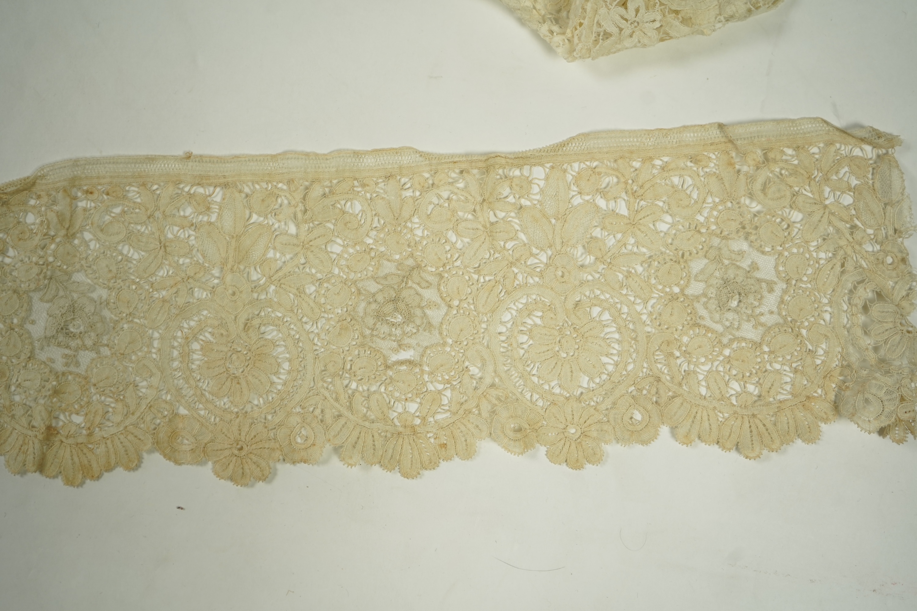 A mixed Brussels bobbin lace and Point de Gaze lace collar, another smaller collar, a similar length of trim and butterfly motif, together with a Brussels bobbin collar and trim, an Irish crochet cuffs, a Valenciennes la